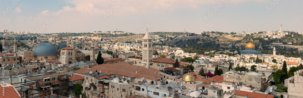 Beautiful panoramic aerial view of the Old City, Tomb of the Prophets and Dome of the Rock. Blue Sunny and Cloudy Sky Overlay. Jerusalem, Capital of Israel. Historic Architecture