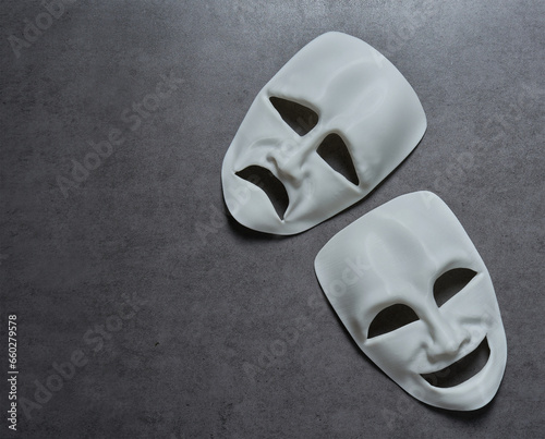 theatre theater theatrical tragedy drama comedy mask on grey background. theatre theater theatrical tragedy drama comedy mask. white happy and sad theatre theater theatrical tragedy drama comedy mask photo