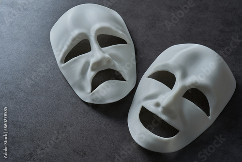 theatre theater theatrical tragedy drama comedy mask on grey background. theatre theater theatrical tragedy drama comedy mask. white happy and sad theatre theater theatrical tragedy drama comedy mask photo
