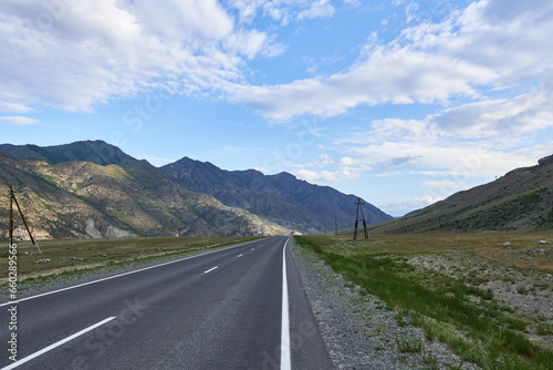 Asphalt road in the mountains. Altai, Siberia, Russia