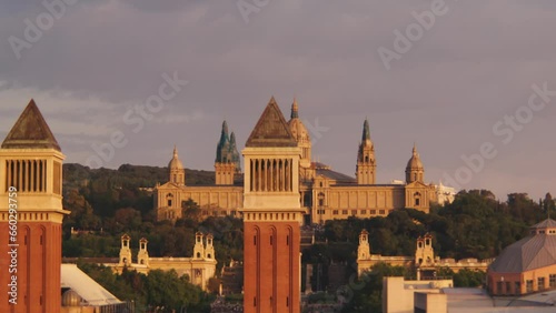 Torres Venecianes twin towers with the view of National Palace in the background at Placa d'Espanya square, Olympic Ring, Barcelona, Spain photo