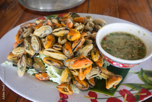 Boiled shellfish  and Cockle eaten with seafood dipping sauce is a famous food in Thailand
