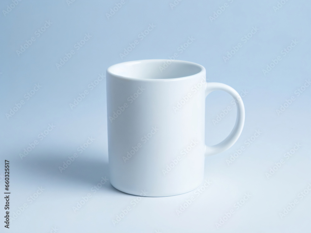 A plain white ceramic mug mock up on a plain blue background A plain white ceramic mug mock up on a plain blue background