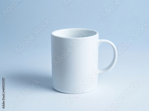 A plain white ceramic mug mock up on a plain blue background