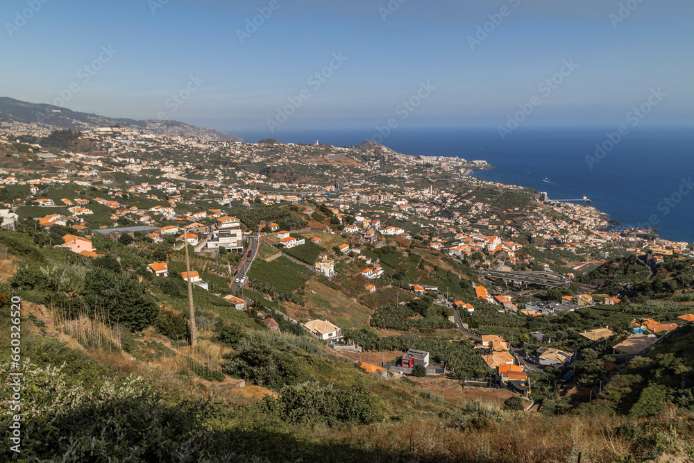 Panoramic view of the sea and different towns on the island of Madeira.