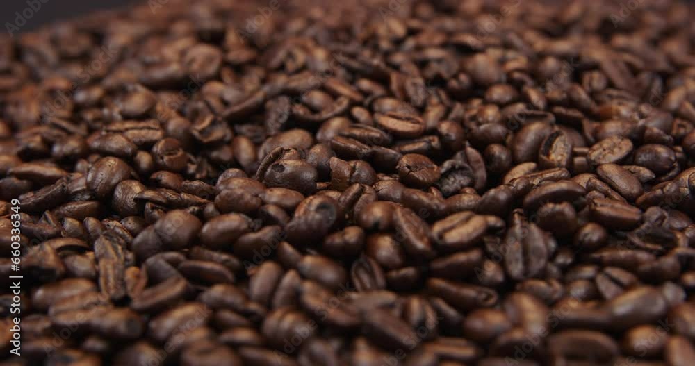 Coffee beans rotating slowly on turntable Coffee beans rotating slowly on turntable