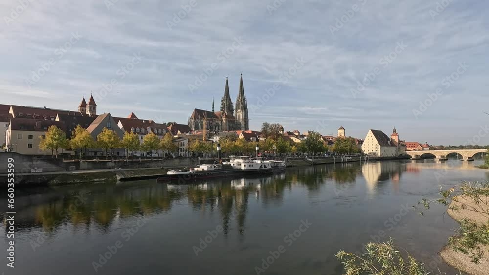 Regensburg on the Danube with stone bridge in sunshine and clouds in autumn Regensburg on the Danube with stone bridge in sunshine and clouds in autumn