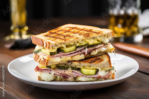gourmet sandwich with brie, ham, and pickles