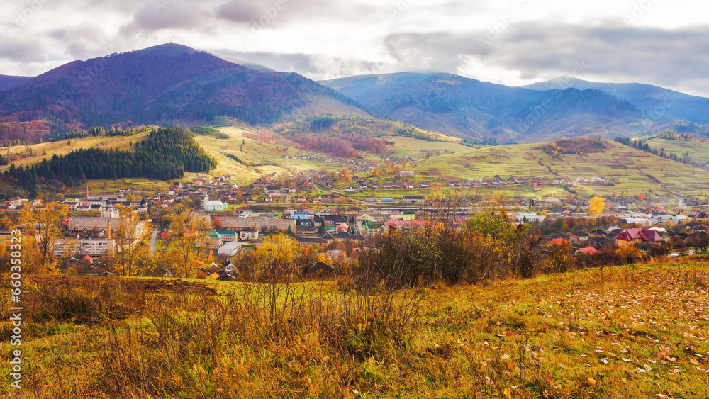 rural landscape in autumn. stunning mountainous countryside scenery with forested hills, valley and open vista