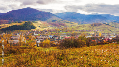 rural landscape in autumn. stunning mountainous countryside scenery with forested hills  valley and open vista