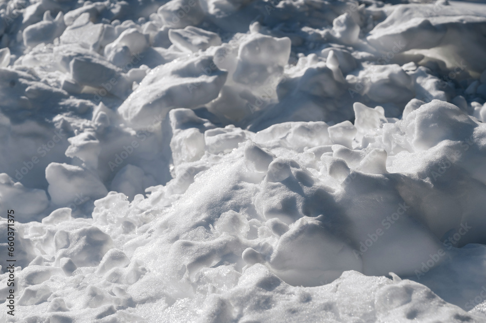 texture of pure white snow in a snowdrift in winter close-up