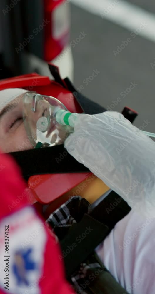 Accident, ambulance and patient with oxygen mask for injury, first aid ...