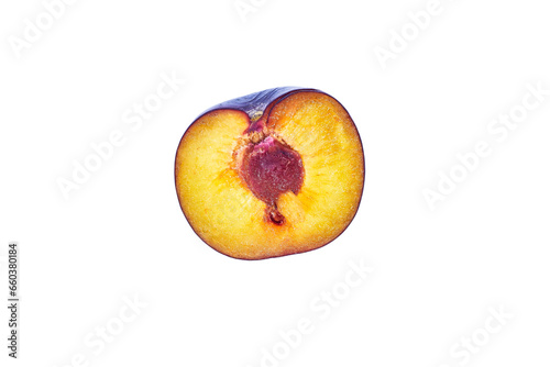 Ripe plum slice isolated on a white background. Fresh fruits