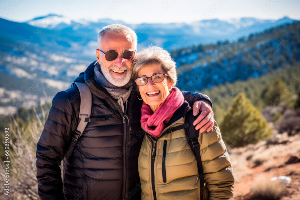 Senior couple while hiking, filled with wonder at the beauty of nature during their active retirement