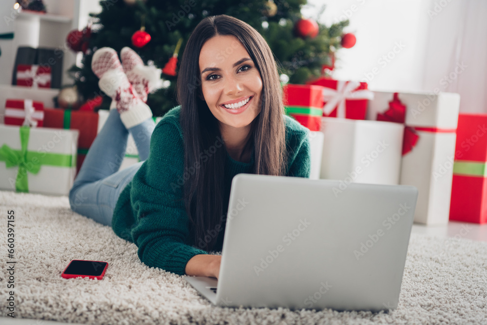 Photo of dreamy pretty girl wear xmas green pullover communicating samsung apple modern device indoors home room Photo of dreamy pretty girl wear xmas green pullover communicating samsung apple modern device indoors home room