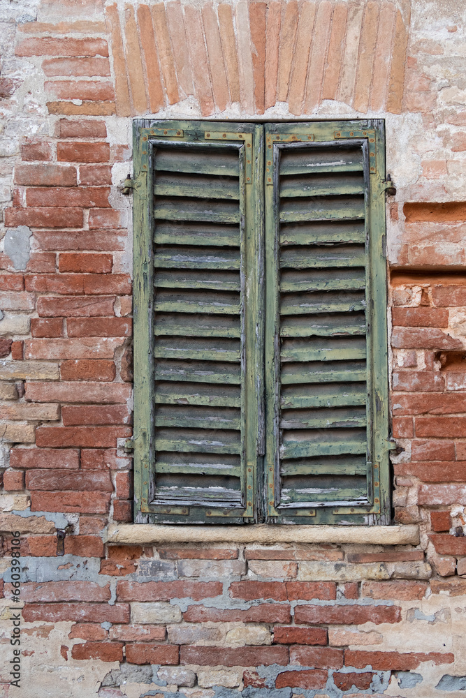 Old wooden window with shutters