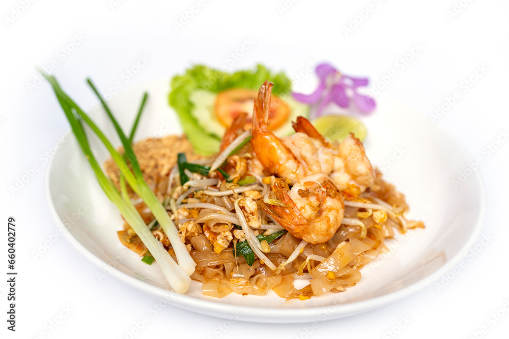 Thai noodle stir fry with a sweet-savoury-sour sauce scattered with crushed peanuts on top with prawn. Thai noodle stir fry with a sweet-savoury-sour sauce scattered with crushed peanuts on top with prawn.