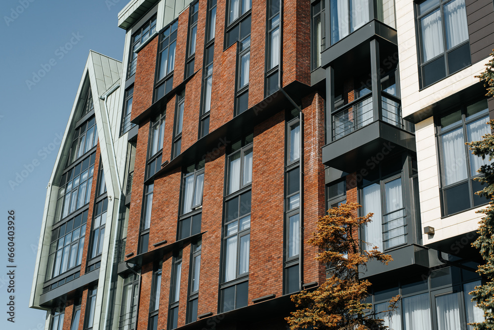 Naklejka premium Modern Scandinavian style apartment building with brown brick exterior
