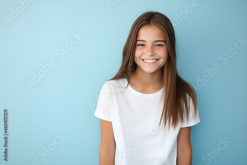 Portrait of a cute fictional white teenager girl smiling candidly. Isolated on a plain colored background. Generative AI. 