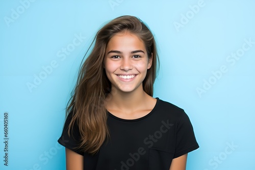 Portrait of a cute fictional white teenager girl smiling candidly. Isolated on a plain colored background. Generative AI. 