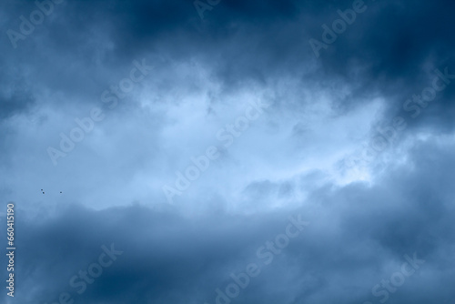 Blue sky with puffy fluffy clouds, horizontal natural background