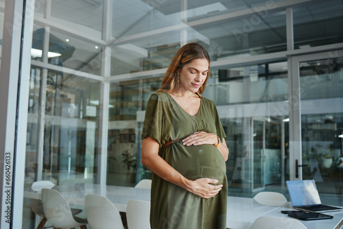 Worker, thinking or pregnant stomach in office break in breathing meditation in company workplace. Belly, woman or mom in pregnancy in career, work and job with peace, affection and care for baby photo