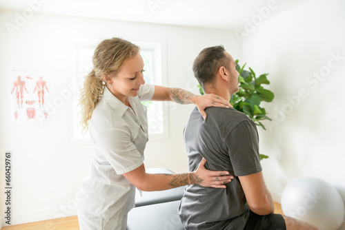 Modern rehabilitation physiotherapy woman with man client