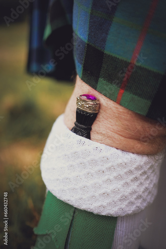 Man wearing a sgian dubh - part of a traditional highland wear outfit at wedding photo