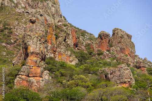 Exploring the Serrania de Chochis with the gigantic reddish rock formation Torre de David near the picturesque village Chochis near Santa Cruz de la Sierra in Bolivia - Traveling South America photo