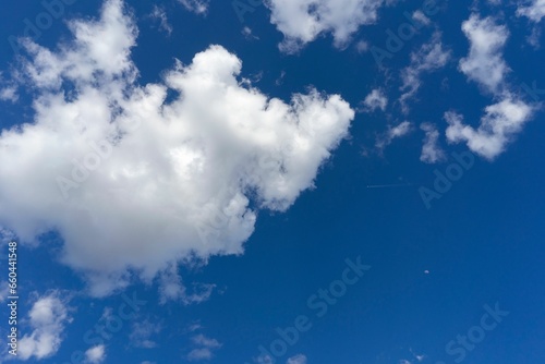 Scenic view of white fluffy clouds in the blue sky on a sunny day in Madrid  Spain