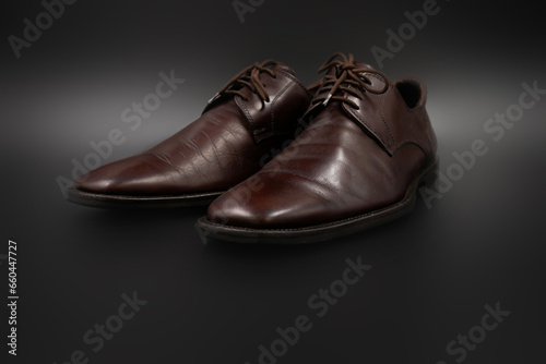 Male fashion with shoes on black background