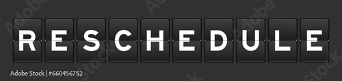 Black color analog flip board with word reschedule on gray background