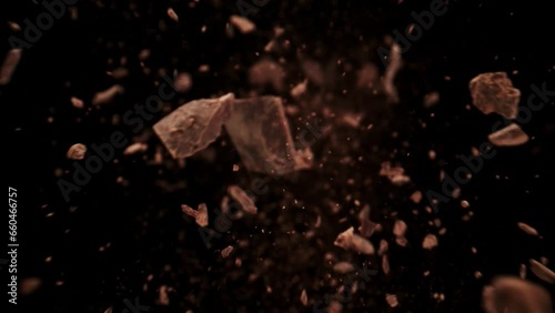 Super Slow Motion Shot of Raw Chocolate Chunks Flying Towards Camera at 1000fps.