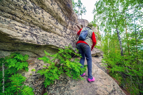 beautiful mature women travels in the ural mountains on the arkul shikhan on a summer day photo