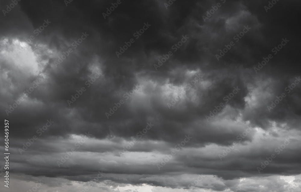 dark clouds make sky in black. Heavy rain thunderstorm. Pattern of clouds overcast predict tornado, Hurricane or thunderstorm and rainy. Dark sky cloudy have storm and lightning thunderbolt. - obrazy, fototapety, plakaty 