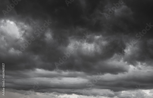 dark clouds make sky in black. Heavy rain thunderstorm. Pattern of clouds overcast predict tornado, Hurricane or thunderstorm and rainy. Dark sky cloudy have storm and lightning thunderbolt. photo