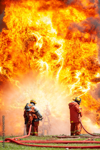 firefighter training new fireman team stop Fire from oil plant blast explode. Fire fighter sprinkle water stop fire burn emergency case at gas station. rescue Care System of Insurance team.
