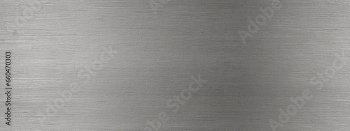 Seamless brushed metal plate background texture. Tileable industrial dull polished stainless steel, aluminum or nickel finish repeat pattern. High resolution silver grey rough metallic photo