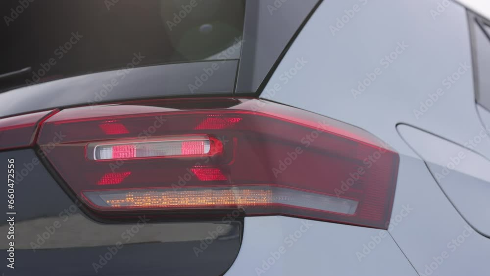 Flashing turn signal indicating the correct direction. Tail light