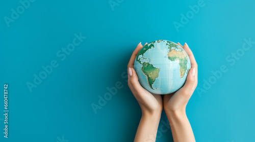 Earth globe in woman's hands on a blue background. ai generative