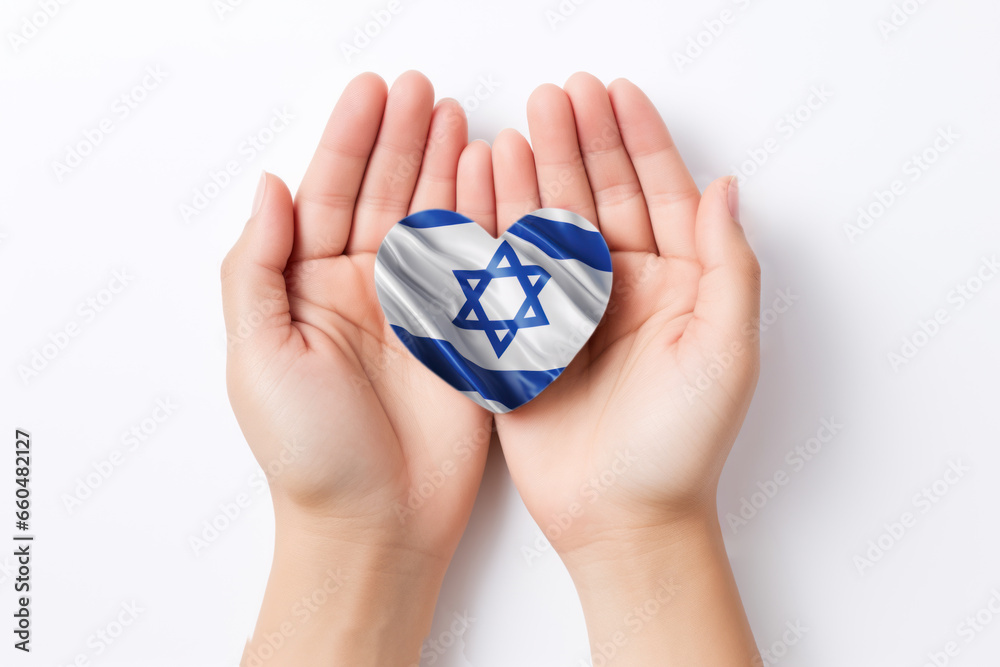 Hands holding Israel flag in heart shape on white background, top view Hands holding Israel flag in heart shape on white background, top view