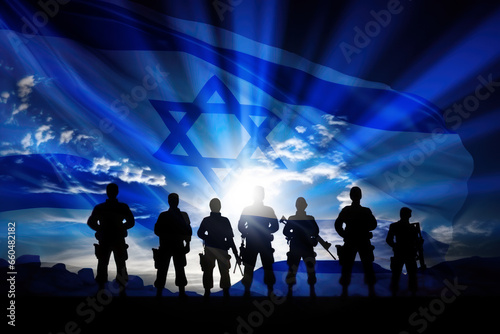 Silhouette of soldiers against the background of the flag of Israel photo