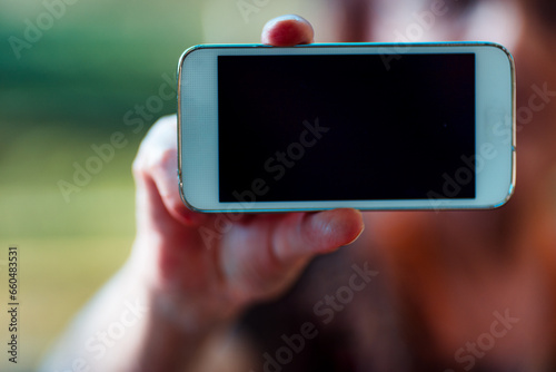 Swollen hands, outdoors, smartphone showcases COPYSPACE signific photo