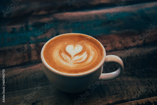 A cup of gourmet coffee on a wooden table