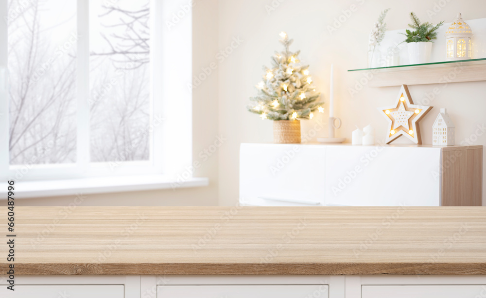 Empty wooden table on background of Christmas interior and window
