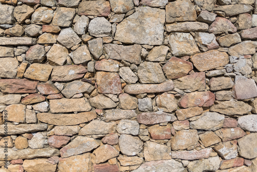 Architecture textures, detailed view of a traditional paired granite masonry, used on a fortress castle wall Architecture textures, detailed view of a traditional paired granite masonry, used on a fortress castle wall