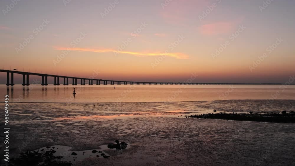 landscape at sunrise next to the Vasco da Gama bridge in Lisbon, Portugal landscape at sunrise next to the Vasco da Gama bridge in Lisbon, Portugal