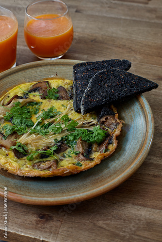 Healthy omelet dish and drinks on wooden table photo