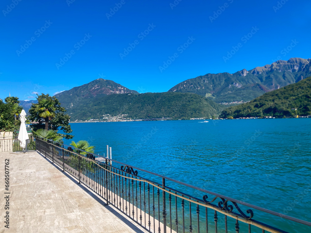 View on Lake Lugano with Mountain in a Sunny Summer Day in Morcote, Ticino, Switzerland.