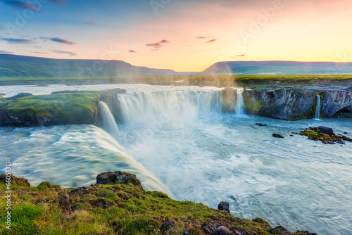 Sunset over Godafoss waterfall flowing in summer at Iceland